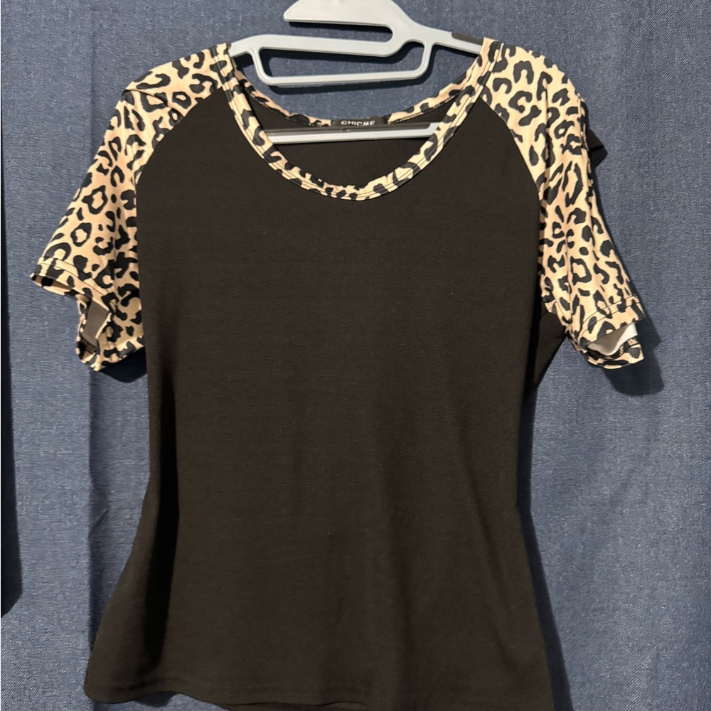 Chic Black Top with Leopard Print Sleeves